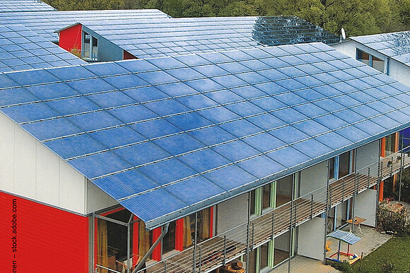 House roofs with photovoltaic systems 